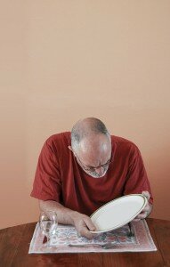 Man studying and empty plate.