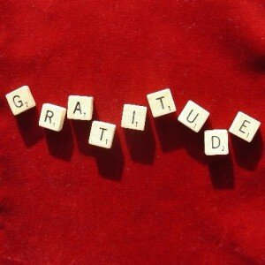 Scrabble tiles forming the word "gratitude."